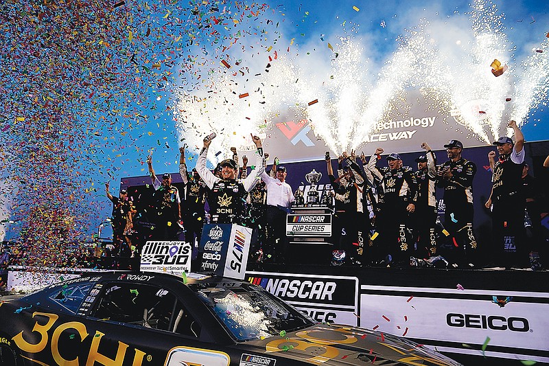 Kyle Busch celebrates Sunday night after winning the NASCAR Cup Series race at World Wide Technology Raceway in Madison, Ill. (Associated Press)