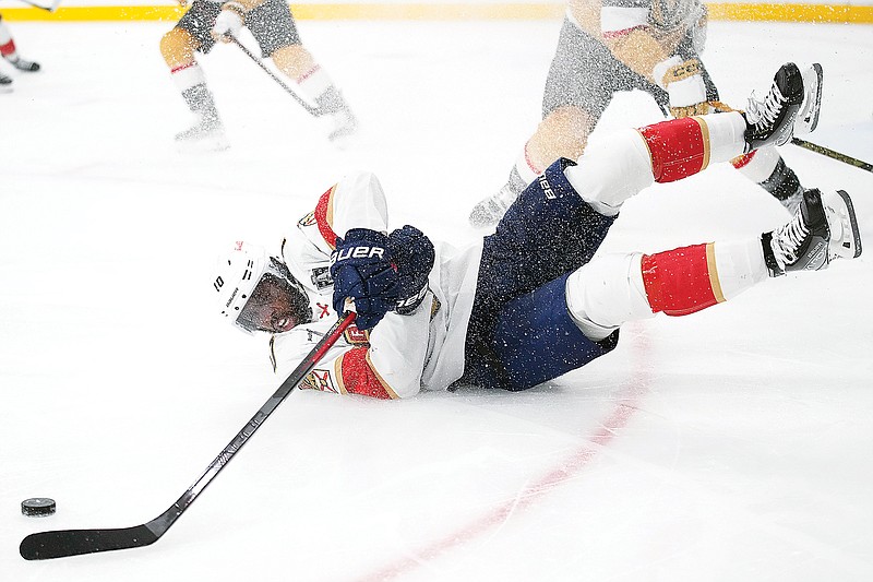 Anthony Duclair of the Panthers tries to pass the puck as he falls during the third period of Monday night’s Game 2 of the Stanley Cup Finals against the Golden Knights in Las Vegas. (Associated Press)