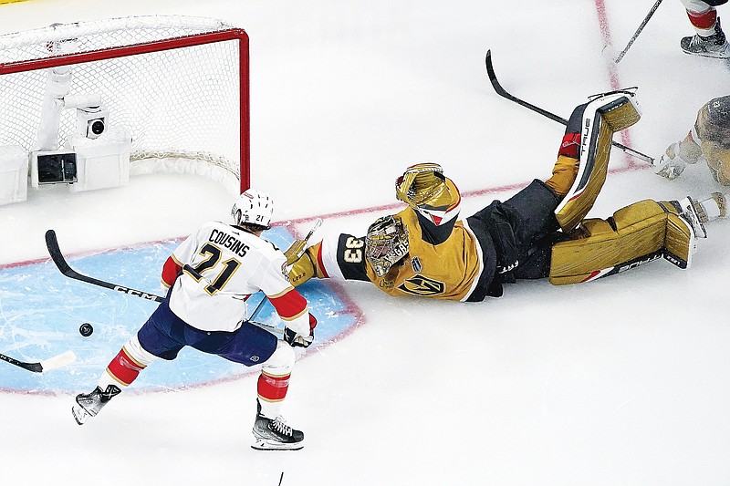 Golden Knights goaltender Adin Hill blocks a shot on goal by Panthers center Nick Cousins during the second period of Saturday night’s Game 1 of the Stanley Cup Finals in Las Vegas. (Associated Press)