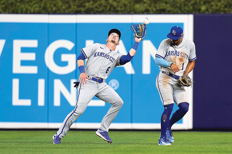 Royals center fielder Drew Waters is unable to catch a ball hit by Yuli Gurriel of the Marlins as right fielder MJ Melendez tries to get out of the way during the fifth inning of Monday night’s game in Miami. Gurriel advanced to second on the error. (Associated Press)