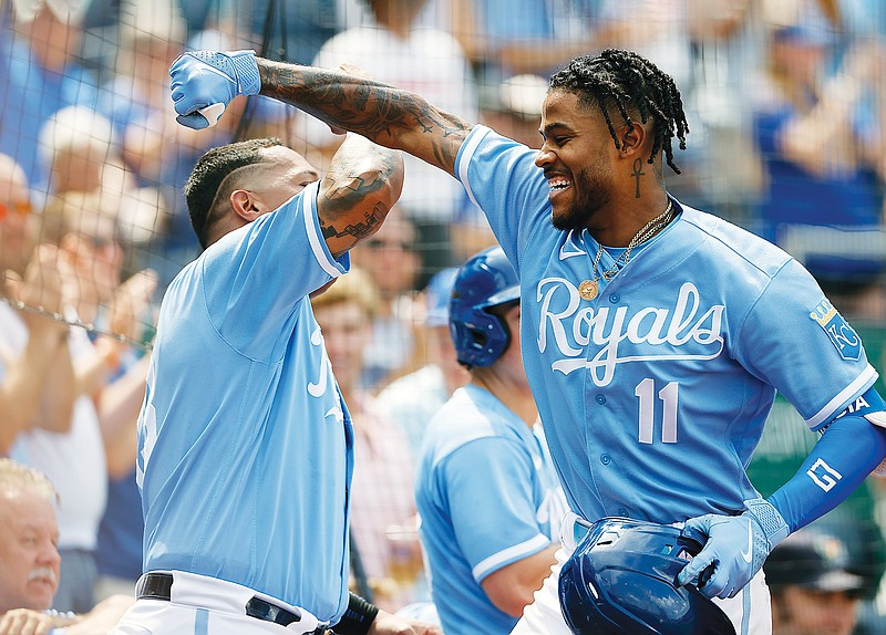 Maikel Garcia (right) celebrates with Royals teammate Salvador Perez after hitting his first major league home run during the eighth inning of Sunday afternoon’s game against the Rockies at Kauffman Stadium in Kansas City. (Associated Press)