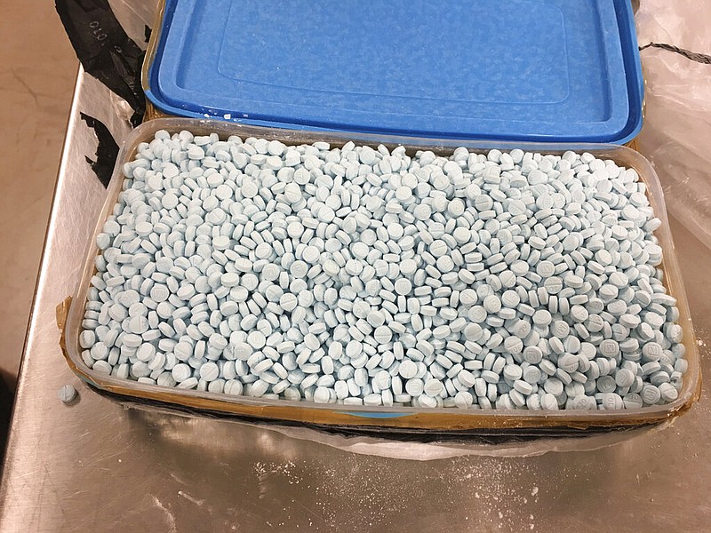 A conainer holding thousands of fentanyl pills is shown in Tempe, Ariz., in this August 2017 file photo. The pills were seized during a bust that netted some 30,000 pills containing illicitly produced fentanyl, a drug that has proven to be among the most lethal in the United States. (Drug Enforcement Administration via AP, File)