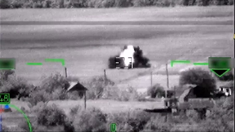This image from video, released by the Russian Defense Ministry Press Service on June 6, 2023, shows what Russia claimed was the destruction of a German-made Leopard tank. But a visual analysis by The Associated Press shows the grainy black-and-white video Russia released to prove it had blown up the tanks actually documented the destruction of a tractor. (Russian Defense Ministry Press Service via AP)