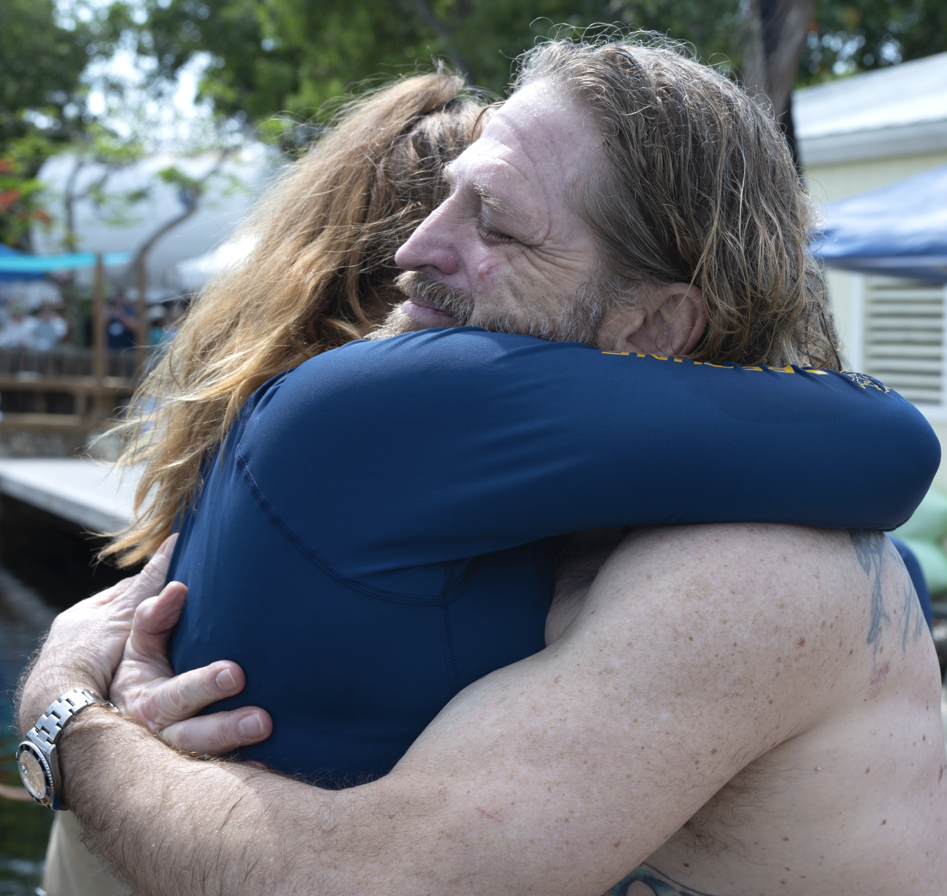 In this photo provided by the Florida Keys News Bureau, diving explorer and medical researcher Dr. Joseph Dituri hugs his lead physician, Dr. Sarah Spelsberg, Friday, June 9, 2023, after living for 100 days in the Jules' Undersea Lodge marine habitat at the bottom of a lagoon in Key Largo, Fla. Dituri broke the previous 73-day record for underwater human habitation at ambient pressure, undertook medical and marine science research and interacted online with more than 5,500 students during his Project Neptune 100 mission organized by the Marine Resources Development Foundation. (Andy Newman/Florida Keys News Bureau via AP)