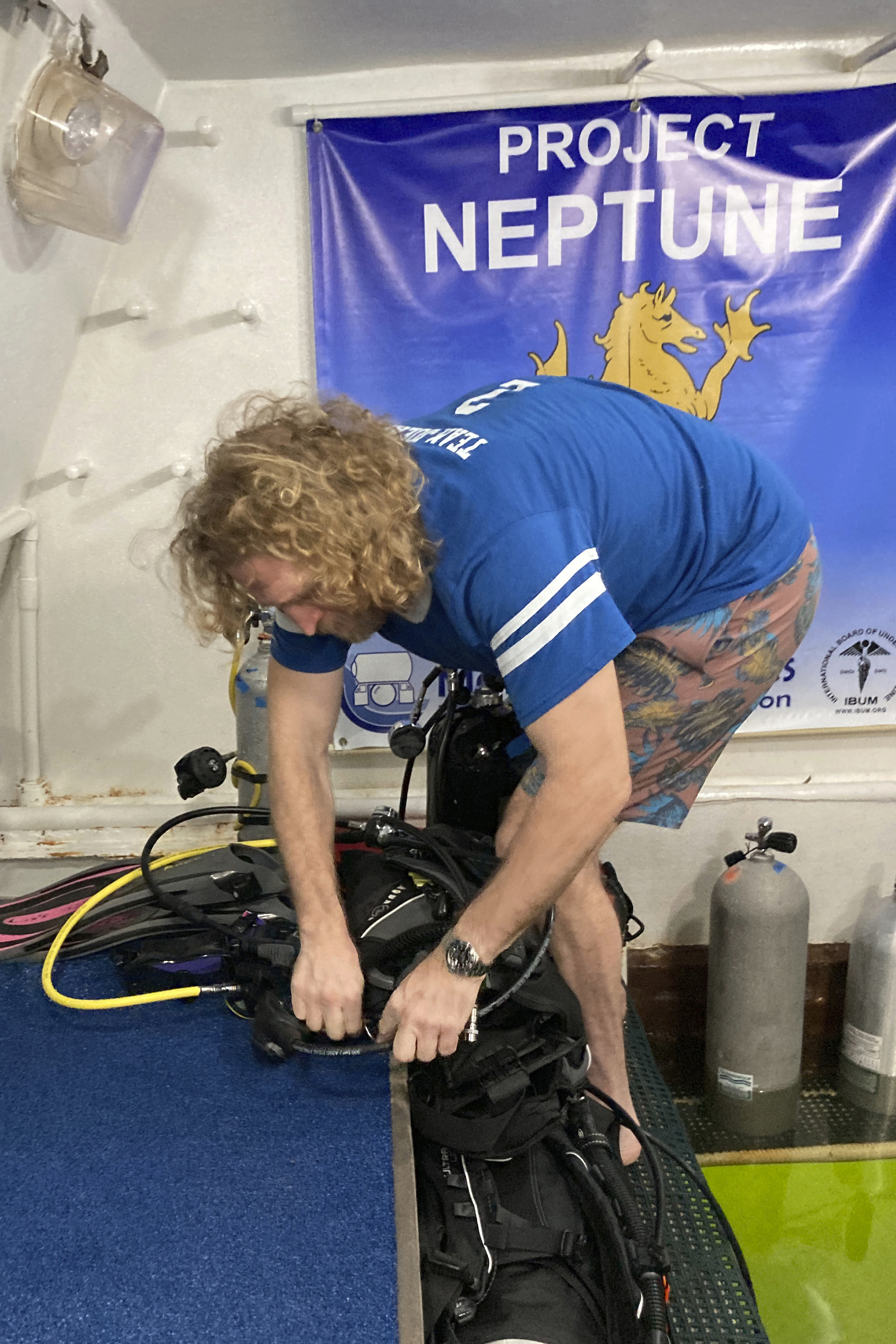 In this photo provided by the Florida Keys News Bureau, diving explorer and medical researcher Dr. Joseph Dituri prepares to leave the Jules' Undersea Lodge marine habitat Friday, June 9, 2023, after living in the habitat for 100 days at the bottom of a Key Largo, Fla., lagoon. Dituri broke the previous 73-day record for underwater human habitation at ambient pressure, undertook medical and marine science research and interacted online with more than 5,500 students during his Project Neptune 100 mission organized by the Marine Resources Development Foundation. (Mike Zimmer/Florida Keys News Bureau via AP)