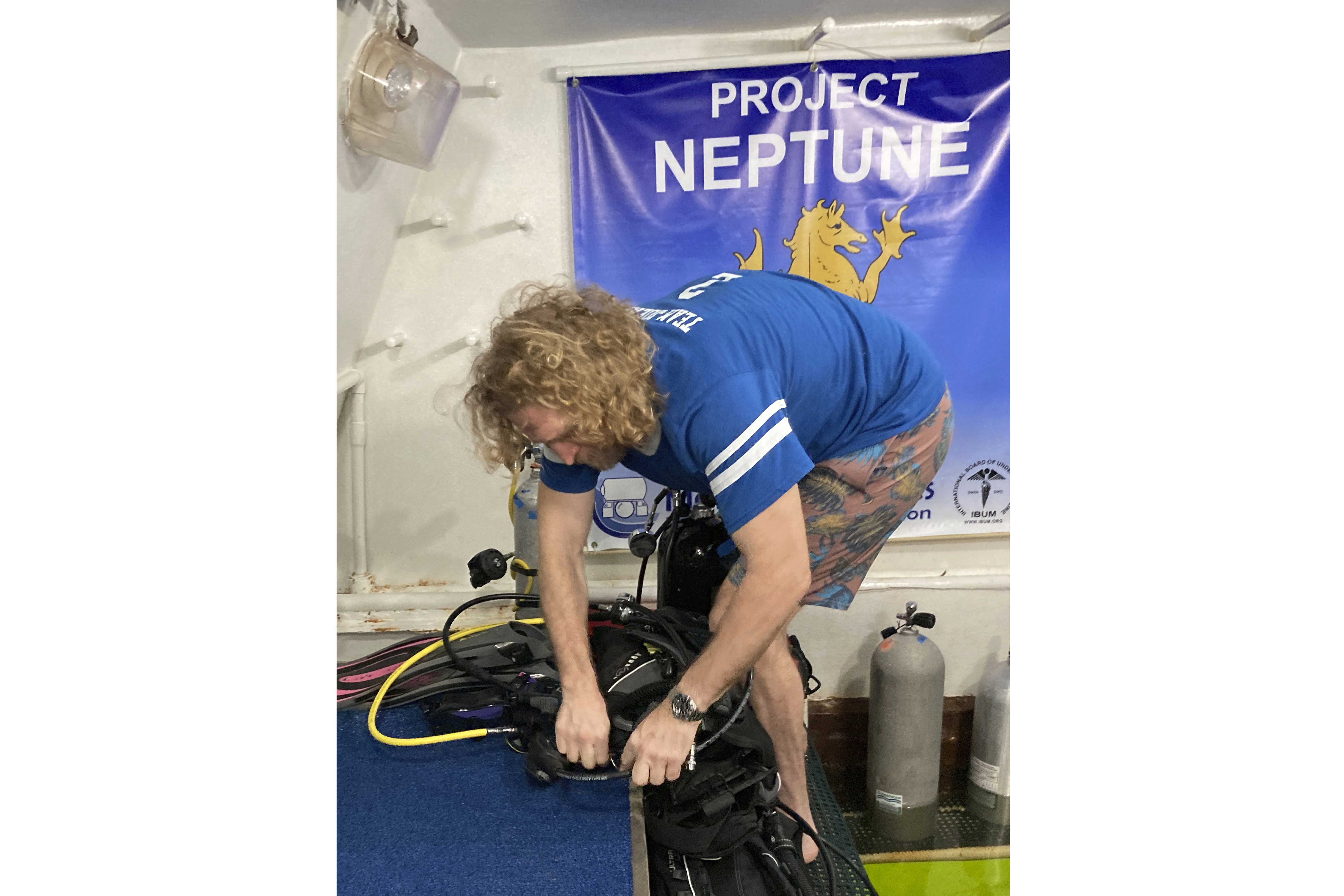 In this photo provided by the Florida Keys News Bureau, diving explorer and medical researcher Dr. Joseph Dituri prepares to leave the Jules' Undersea Lodge marine habitat Friday, June 9, 2023, after living in the habitat for 100 days at the bottom of a Key Largo, Fla., lagoon. Dituri broke the previous 73-day record for underwater human habitation at ambient pressure, undertook medical and marine science research and interacted online with more than 5,500 students during his Project Neptune 100 mission organized by the Marine Resources Development Foundation. (Mike Zimmer/Florida Keys News Bureau via AP)
