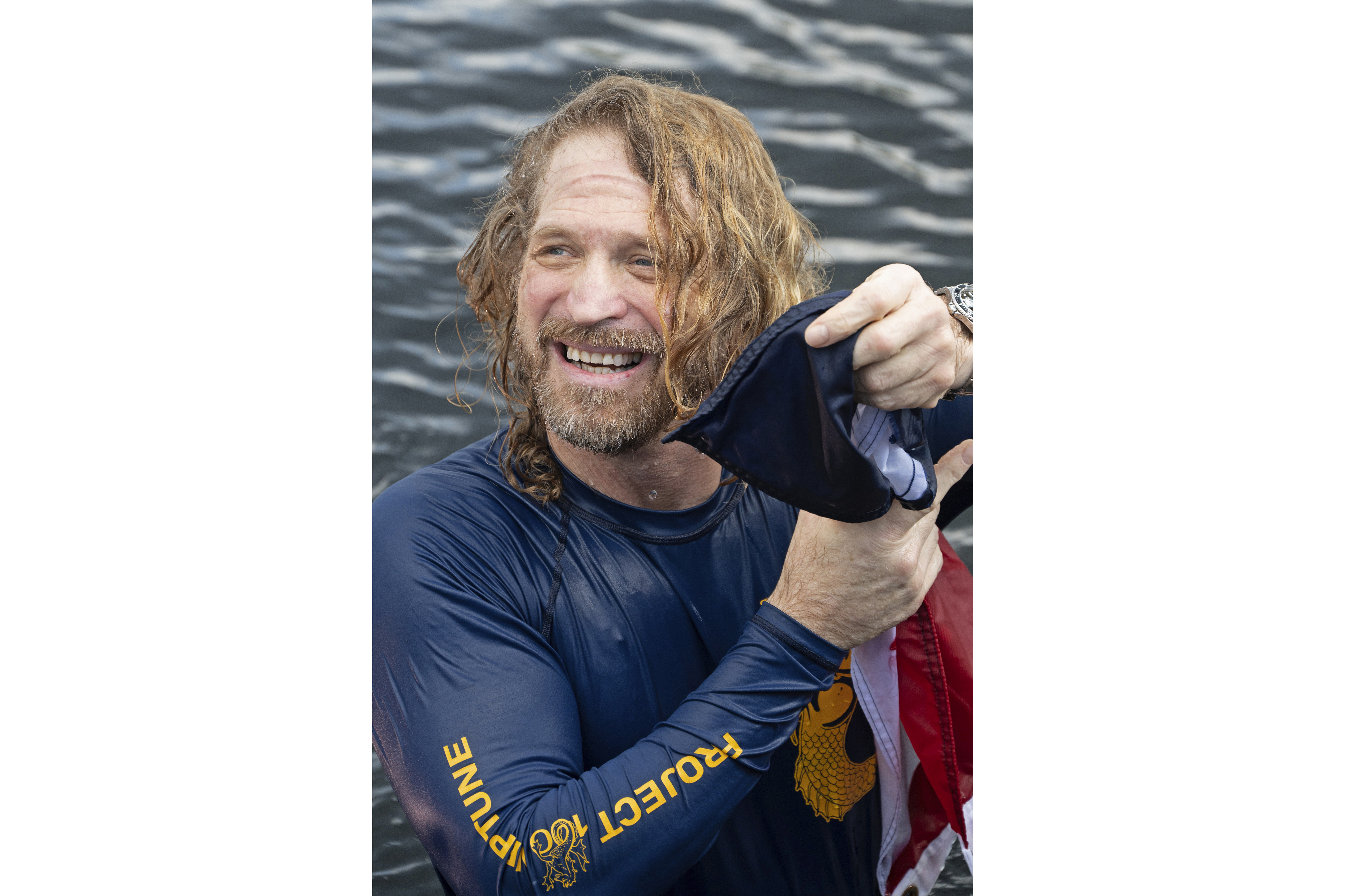 In this photo provided by the Florida Keys News Bureau, diving explorer and medical researcher Dr. Joseph Dituri emerges from the water Friday, June 9, 2023, after living for 100 days in the Jules' Undersea Lodge marine habitat at the bottom of a lagoon in Key Largo, Fla. Dituri broke the previous 73-day record for underwater human habitation at ambient pressure, undertook medical and marine science research and interacted online with more than 5,500 students during his Project Neptune 100 mission organized by the Marine Resources Development Foundation. (Andy Newman/Florida Keys News Bureau via AP)
