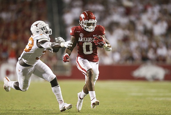 Arkansas running back AJ Green (0) carries the ball during a game against Texas on Saturday, Sept. 11, 2021, in Fayetteville.