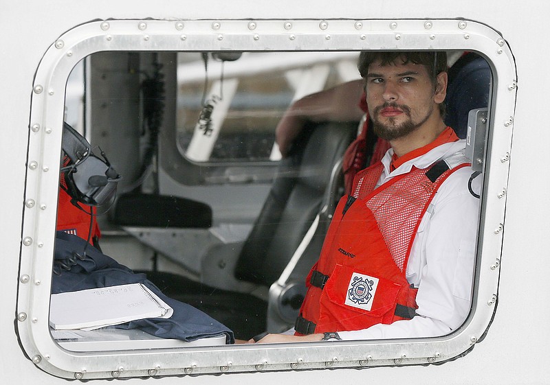 FILE - Nathan Carman arrives in a small boat at the U.S. Coast Guard station, in Boston, on Sept. 27, 2016. The man charged with killing his mother at sea during a 2016 fishing trip off the coast of New England in what prosecutors say was a scheme to inherit millions of dollars has died, federal authorities said Thursday, June 15, 2023. (AP Photo/Michael Dwyer, File)