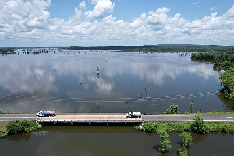 Cars drive past Lake Conway on Thursday, June 15, 2023. (Arkansas Democrat-Gazette/Stephen Swofford)