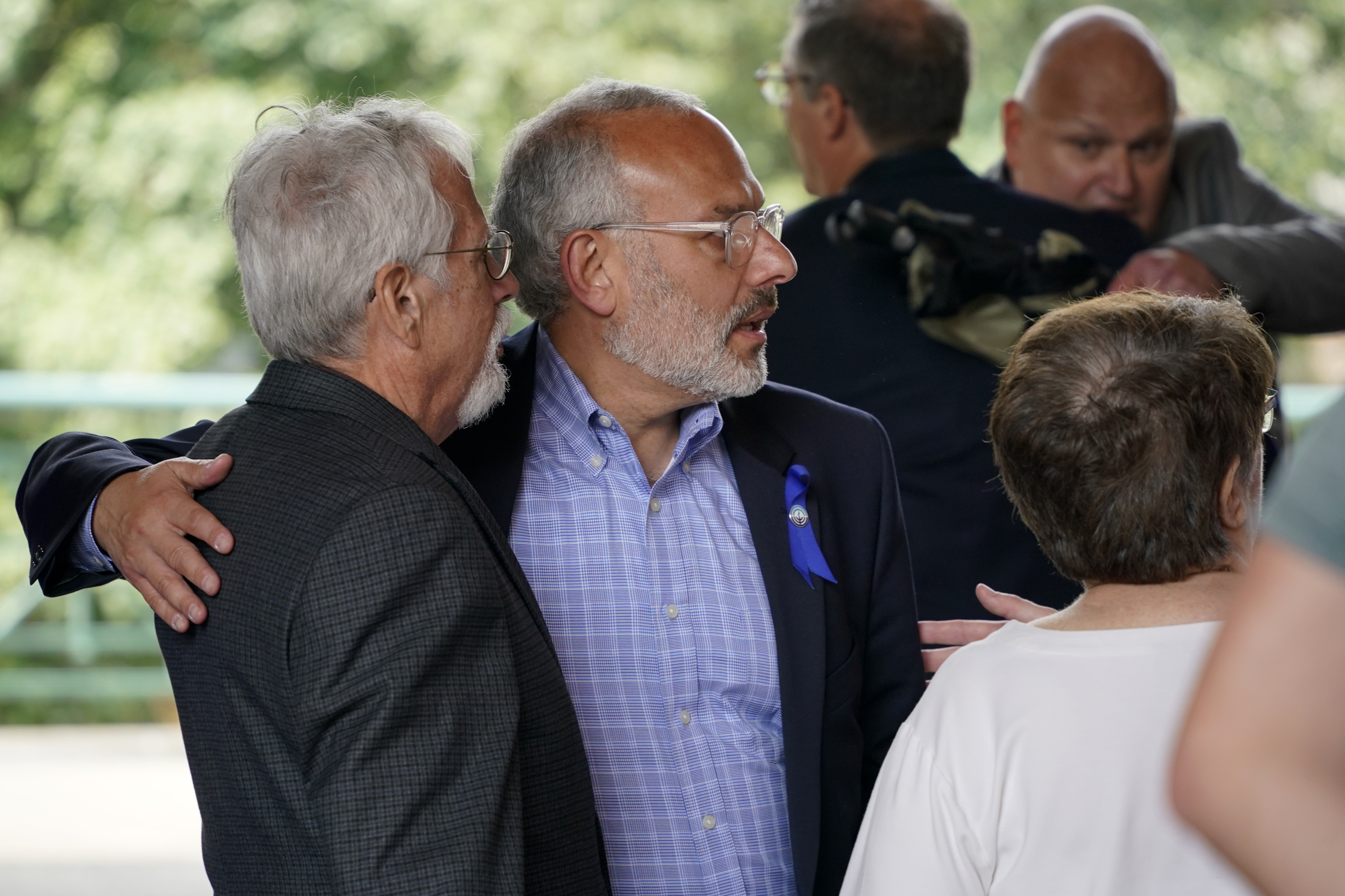Stephen Cohen, left, co-president of Congregation New Light, gets a hug from Jeffrey Finkelstein, CEO of the Jewish Federation of Pittsburgh, center, Stephen Cohen, left, co-president of Congregation New Light, gets a hug from Jeffrey Finkelstein, CEO of the Jewish Federation of Pittsburgh, center, after Robert Bowers was found guilty, Friday, June 16, 2023, in Pittsburgh. Bowers, a truck driver who spewed hatred of Jews, was convicted Friday of barging into a Pittsburgh synagogue on the Jewish Sabbath and fatally shooting 11 congregants in an act of antisemitic terror for which he could be sentenced to die. (AP Photo/Gene J. Puskar)