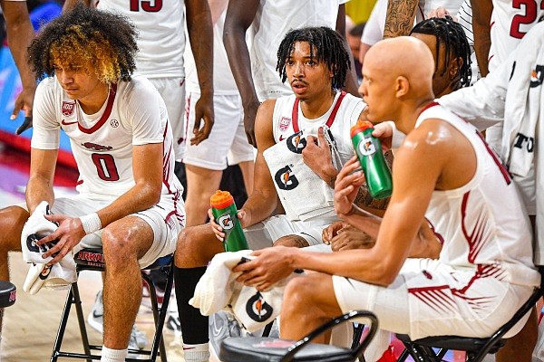 Arkansas guard Anthony Black (0), guard Nick Smith Jr. (3) and guard/forward Jordan Walsh (13) sit during a timeout, Saturday, March 4, 2023, during the second half of the Razorbacks’ 88-79 loss to the Kentucky Wildcats at Bud Walton Arena in Fayetteville.