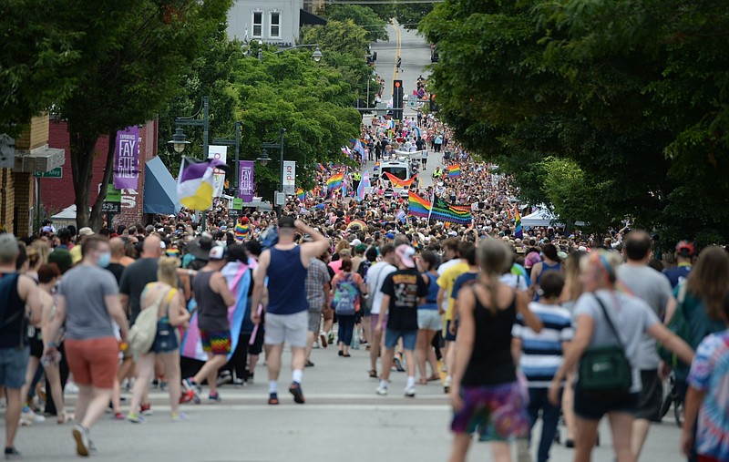 Participants make their way down Fayetteville's Dickson Street during the 17th annual Northwest Arkansas Pride Parade in this June 26, 2021 file photo. (NWA Democrat-Gazette/Andy Shupe)