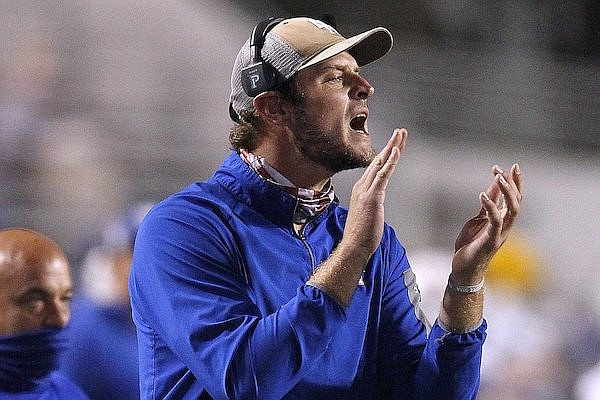 Mountain Home assistant coach Ryan Mallett (right) yells to his players during the second quarter of the Bombers' 45-21 loss to Little Rock Parkview on Friday, Nov. 6, 2020, at War Memorial Stadium in Little Rock.
