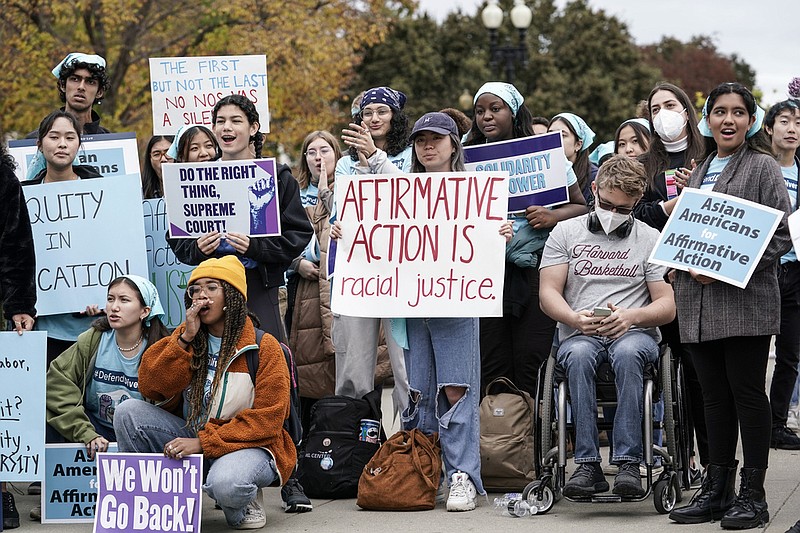 FILE - Activists demonstrate as the Supreme Court hears oral arguments on a pair of cases that could decide the future of affirmative action in college admissions, in Washington, Oct. 31, 2022. (AP Photo/J. Scott Applewhite, File)