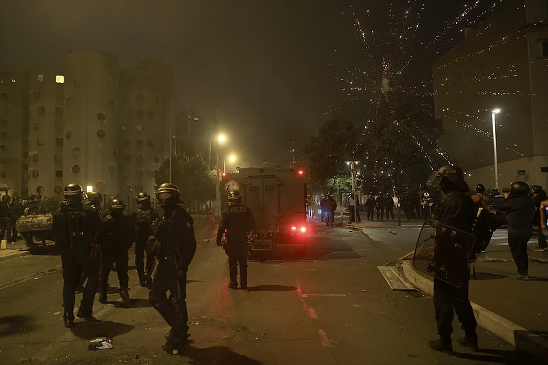 875 arrested and 200 police officers hurt on France's 3rd night of ...