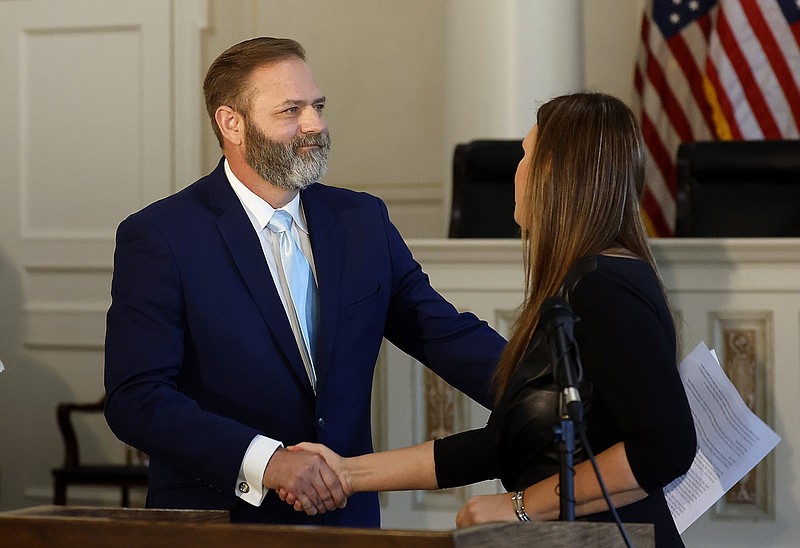 Cody Hiland (left) shakes hands with Gov. Sarah Huckabee Sanders at the state Capitol in Little Rock in this July 3, 2023 file photo. Hiland had just been introduced as the newest justice on the Arkansas Supreme Court, filling the open seat left by the passing of Justice Robin F. Wynne in late June. (Arkansas Democrat-Gazette/Thomas Metthe)