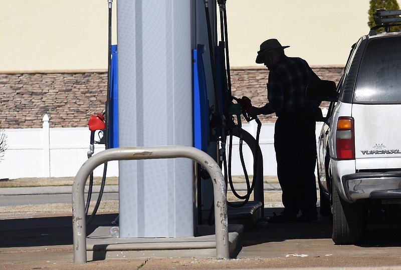 Staff Photo by Matt Hamilton / A customer purchases gas at the Exxon on Shallowford Road in Chattanooga on Monday March 8, 2021.