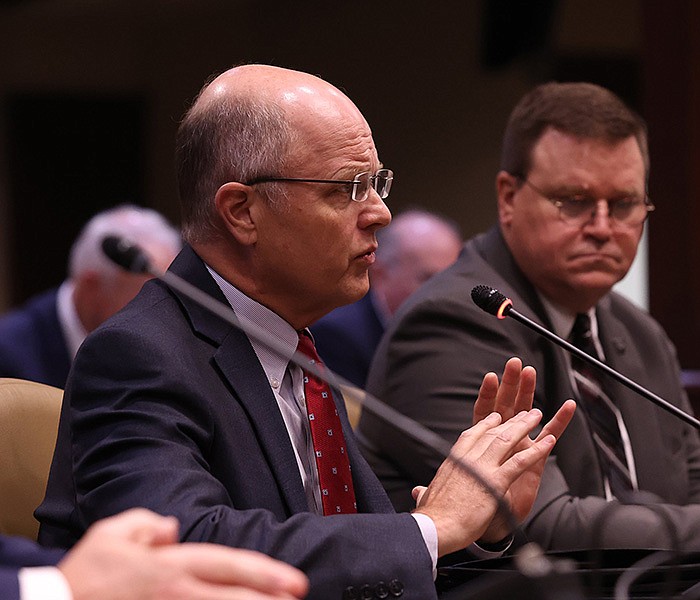 Arkansas Insurance Department Commissioner Alan McClain answers a question during a meeting of the Performance Evaluation and Expenditure Review Subcommittee at the Arkansas state Capitol on Tuesday, July 18, 2023. (Arkansas Democrat-Gazette/Colin Murphey)