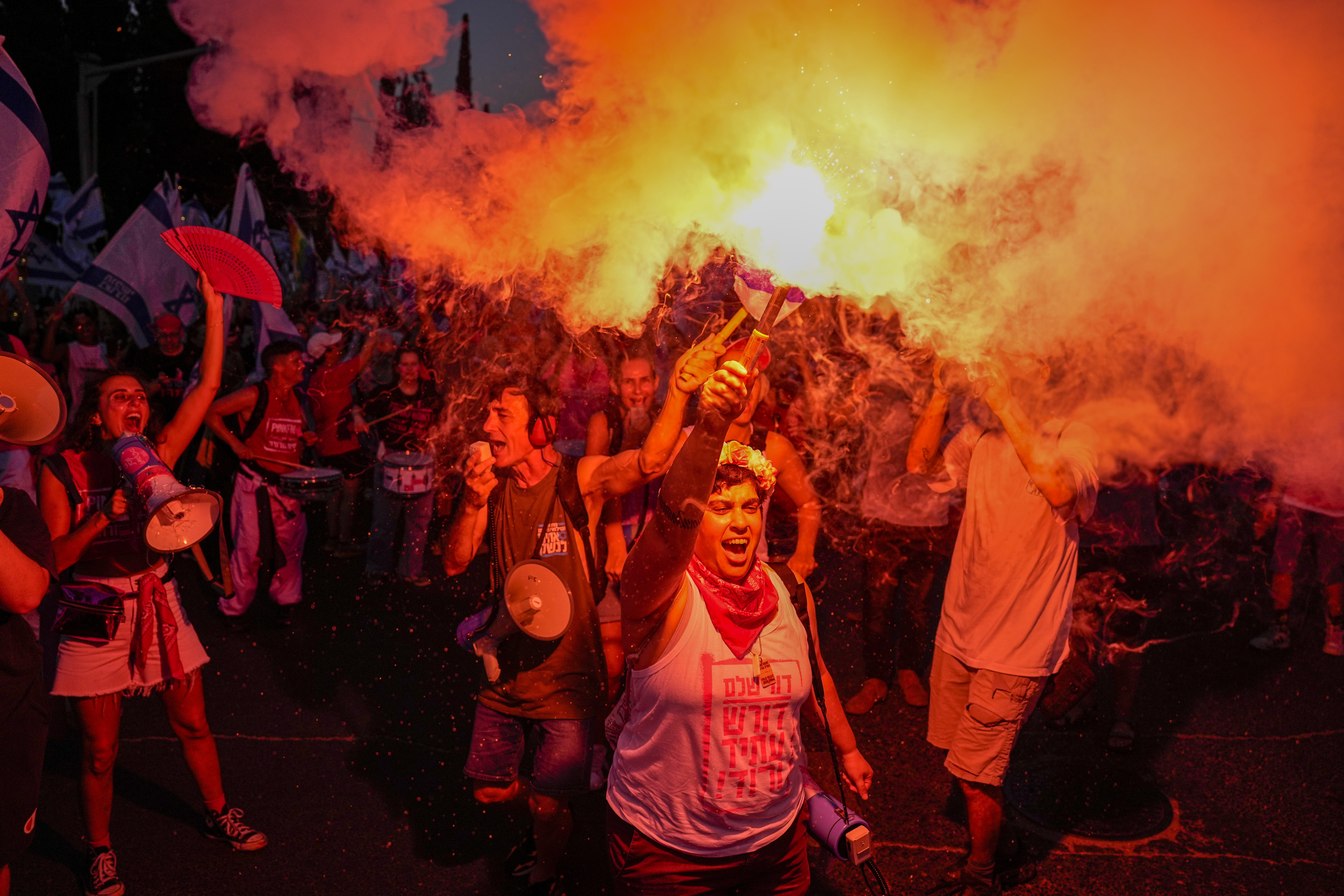 Israelis protest against plans by Prime Minister Benjamin Netanyahu's government to overhaul the judicial system in Tel Aviv, Israel, Saturday, July 15, 2023. (AP Photo/Ariel Schalit)