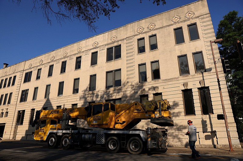 A crane is used to install a new elevator in the Arkansas Democrat-Gazette building in downtown Little Rock, which has been the newspaper’s home since 1930.
(Arkansas Democrat-Gazette/Colin Murphey)
