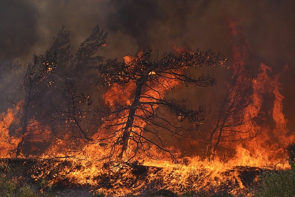 A firefighting plane crashes as fires rage out of control and new