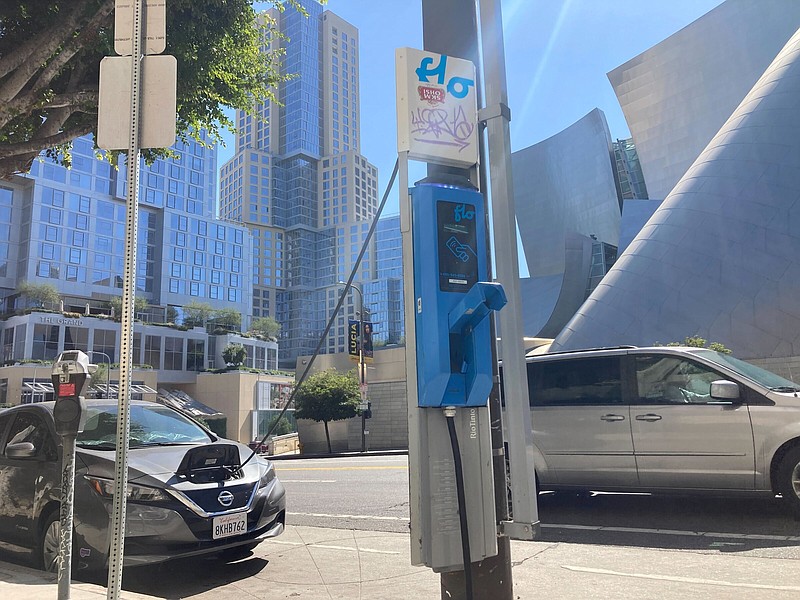 An electric vehicle charges on a publicly accessible pole-mounted charger in Los Angeles.
(AP)
