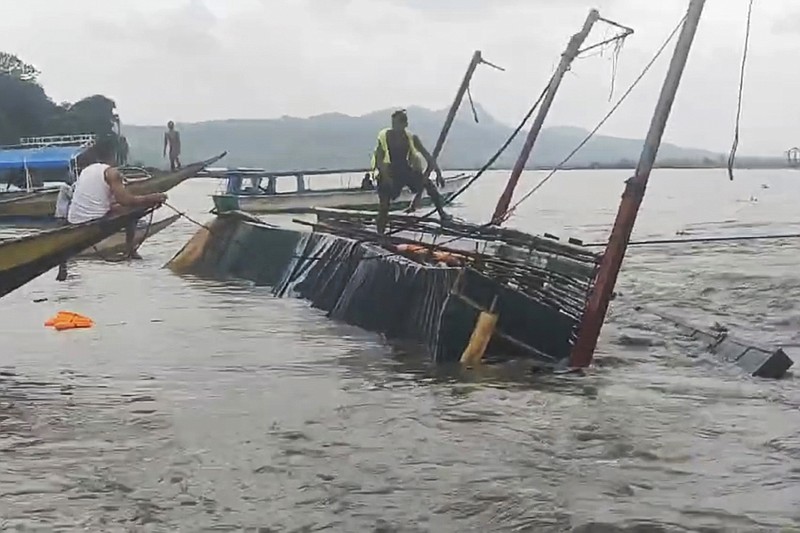 21 dead and 40 rescued after a wind-tossed boat overturns in the ...