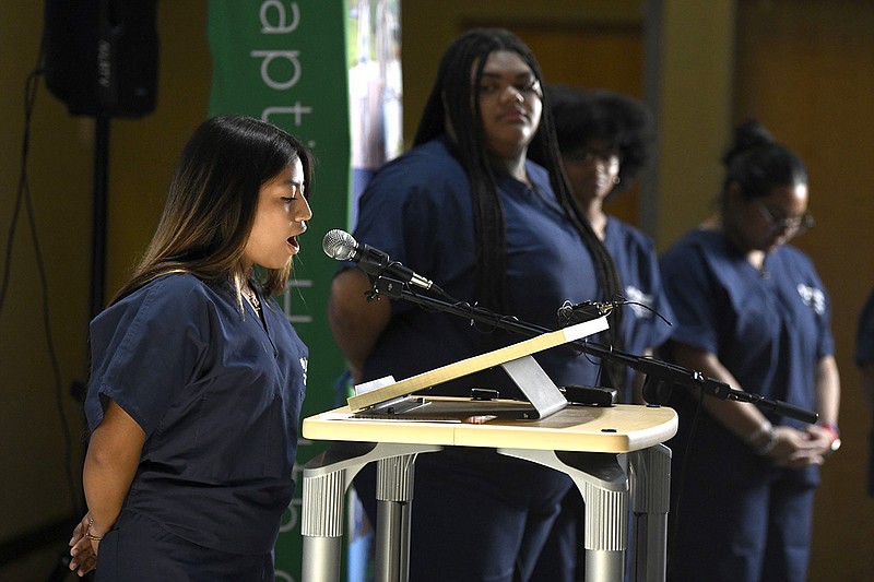 Ana Rojas, a North Little Rock High School 12th-grader, talks about her experience with the new Baptist Health Academy of Medical Sciences during an announcement at North Little Rock High School on Thursday.
(Arkansas Democrat-Gazette/Stephen Swofford)