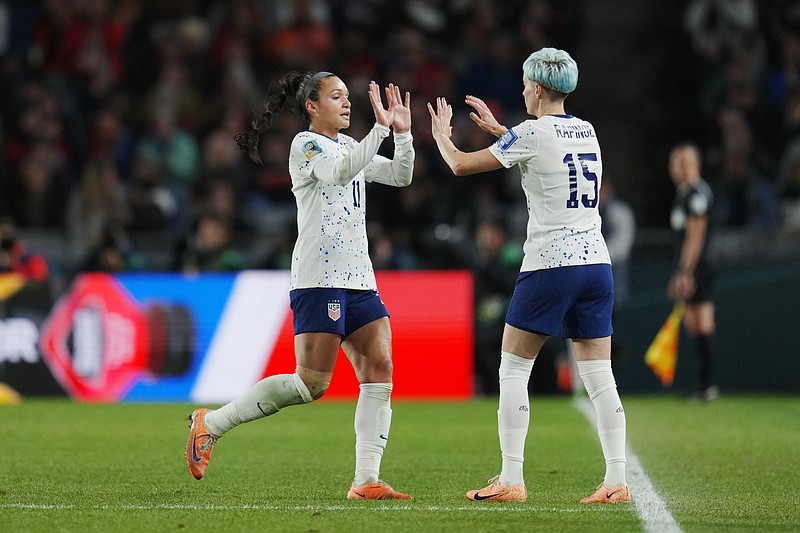 United States' Sophia Smith, left, is replaced by Megan Rapinoe during the second half of the FIFA Women's World Cup Group E soccer match between Portugal and the United States at Eden Park in Auckland, New Zealand, Tuesday, Aug. 1, 2023. (AP Photo/Abbie Parr)