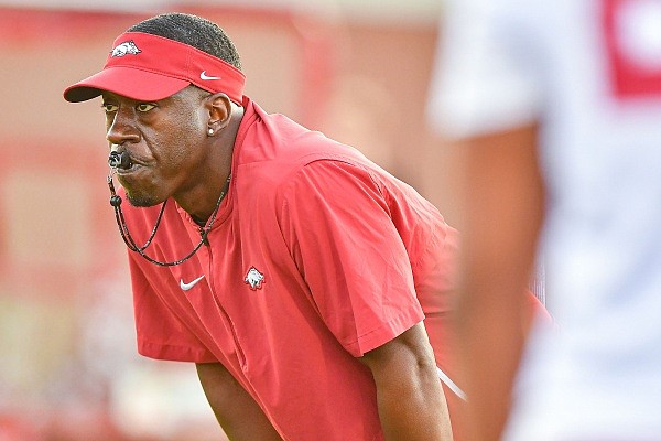 Arkansas running backs coach Jimmy Smith looks on during a drill, Friday, Aug. 4, 2023, during the Razorbacks’ first practice of fall camp at the Fred W. Smith Football Center in Fayetteville.Visit nwaonline.com/photo for the photo gallery.