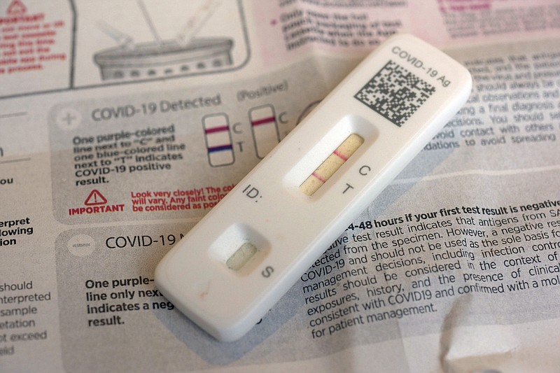 A covid-19 antigen home test indicating a positive result is photographed in New York in this April 5, 2023 file photo. (AP/Patrick Sison)