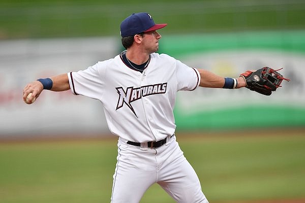Northwest Arkansas Naturals third baseman Cayden Wallace throws between innings Wednesday, Aug. 9, 2023, during play at Arvest Ballpark in Springdale. Wallace, a former Arkansas Razorback and 49th pick of the 2022 Draft by the Royals, recently arrived at Class AA Northwest Arkansas.
