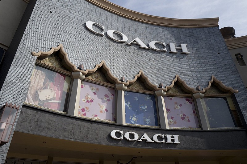 Coach owner buys Versace parent company to create new US luxury fashion  giant