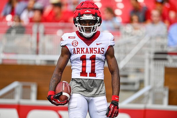 Arkansas receiver Sam Mbake (11) reacts after catching a touchdown pass, Saturday, April 15, 2023, during the Red-White Spring Football Showcase at Donald W. Reynolds Razorback Stadium in Fayetteville.