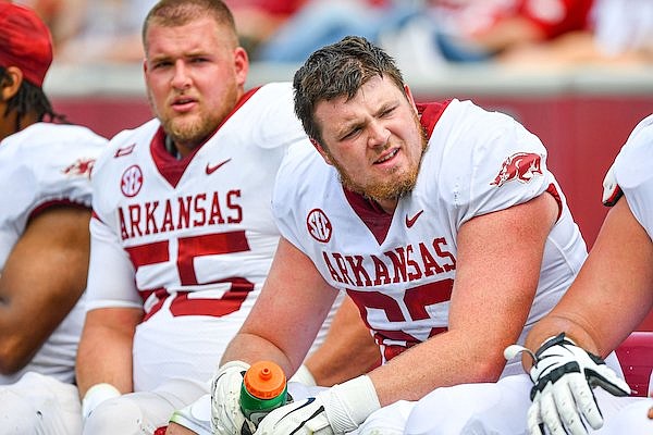 Arkansas offensive linemen Brady Latham (62) and Beaux Limmer (55) are shown during the Razorbacks' spring showcase on Saturday, April 15, 2023, in Fayetteville.