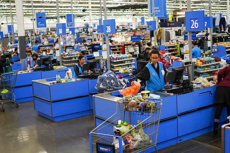 Cashiers process purchases at a Walmart Supercenter in North Bergen, N.J., in this Feb. 9, 2023 file photo. (AP/Eduardo Munoz Alvarez)