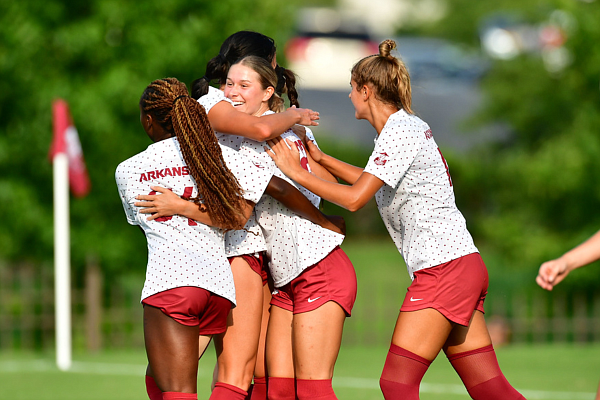 Arkansas sophomore midfielder Ainsley Erzen celebrates with teammates after scoring the Razorbacks' first goal during a 6-0 victory Thursday, Aug. 17, 2023, at Razorback Field in Fayetteville.