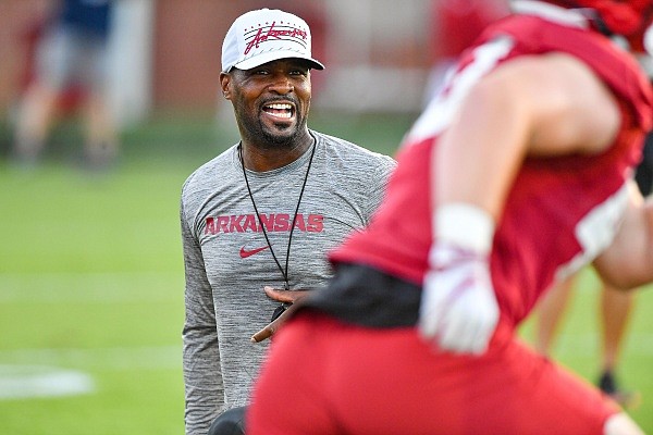 Arkansas defensive coordinator Travis Williams reacts, Friday, Aug. 4, 2023, during the Razorbacks’ first practice of fall camp at the Fred W. Smith Football Center in Fayetteville.