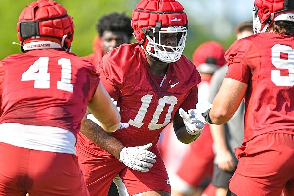 Arkansas defensive linemen Anthony Booker participates in drills, Friday, Aug. 11, 2023, during practice at the Fred W. Smith Football Center in Fayetteville.