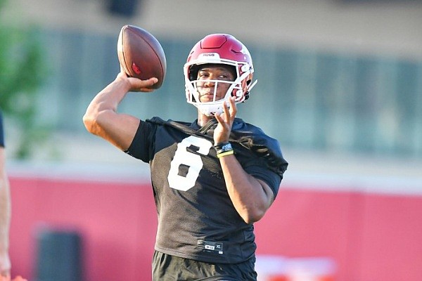 Arkansas quarterback Jacolby Criswell (6) passes Friday, Aug. 4, 2023, during the Razorbacks’ first practice of fall camp at the Fred W. Smith Football Center in Fayetteville.
