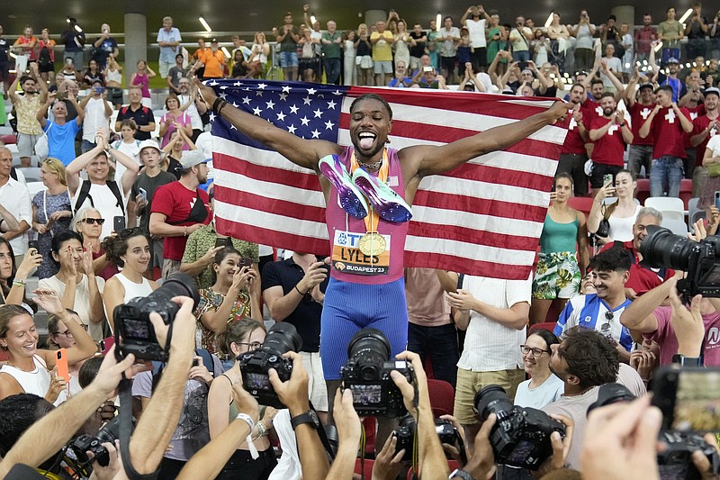 United States sprinter Noah Lyles celebrates after winning the gold medal in the men’s 200-meter final Friday during the World Athletics Championships in Budapest, Hungary. With the win, Lyles became the first to win the 100- and 200-meter sprints at worlds since Usain Bolt in 2015.
(AP/Matthias Schrader)