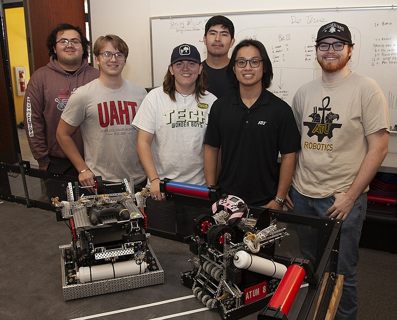 Members of the Arkansas Tech University robotics team showcase their work in this undated courtesy photo. From left are Ryan Nanthalangsy, Collin Easterling, Hunter Mathis, Juan Leon, Thomas Dang and Chris Osborne. (Photo courtesy Arkansas Tech University)