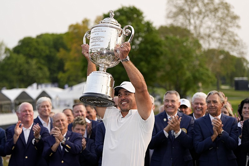 FILE - Brooks Koepka holds the Wanamaker trophy after winning the PGA Championship golf tournament at Oak Hill Country Club on Sunday, May 21, 2023, in Pittsford, N.Y. The majors lacked drama, but not inspiration or phenomenal play. The last big event is the Ryder Cup.(AP Photo/Eric Gay, File)