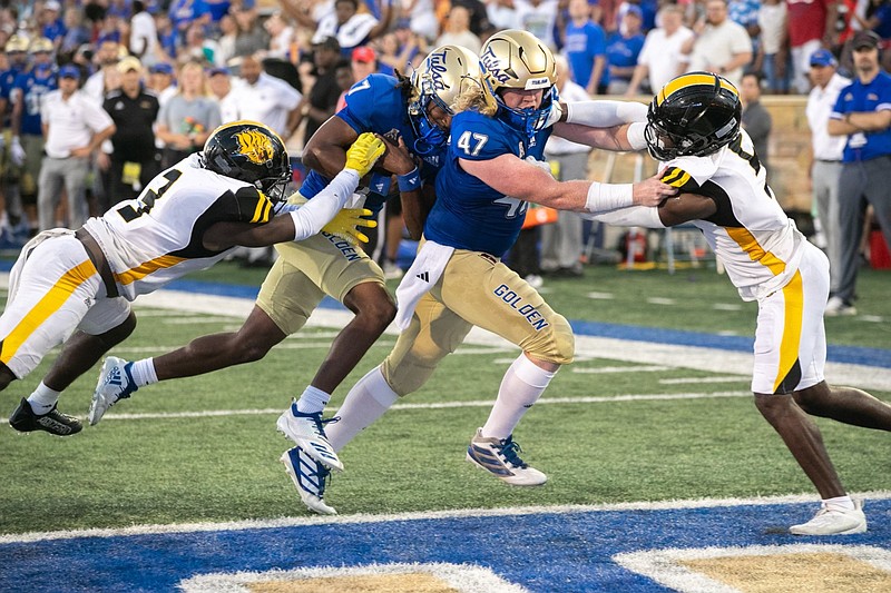 Tulsa Golden Hurricane quarterback Cardell Williams (7) carries the ball into the end zone to score a touchdown during the second quarter of the University of Tulsa's season opener against Arkansas-Pine Bluff on Thursday, Aug. 31, 2023 at Chapman Stadium in Tulsa. Blocking for the Golden Hurricane is cornerback Kyron Grayson (47). (Tulsa World courtesy photo)