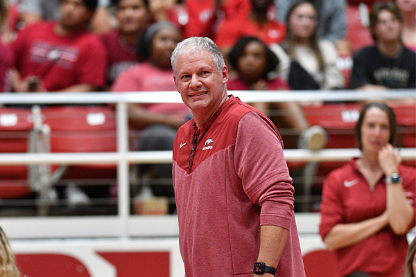 Arkansas coach Jason Watson watches Wednesday, Aug. 20, 2023, during play against Wisconsin in Barnhill Arena in Fayetteville.