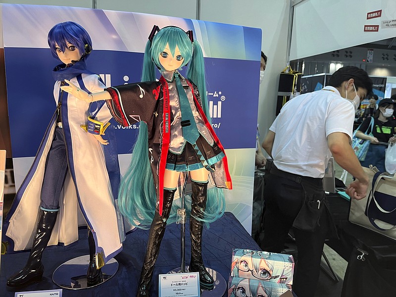 A figure of Hatsune Miku is displayed at an event at a Tokyo suburban hall, Makuhari Messe, in Chiba, Japan, Friday, Sept. 1, 2023, in celebration of her 16th birthday. Hatsune Miku has always been 16 years old and worn long aqua ponytails. She is Japan's most famous Vocaloid, a computer-synthesized singing voice software that, in her case, comes with a virtual avatar. (AP Photo/Yuri Kageyama)