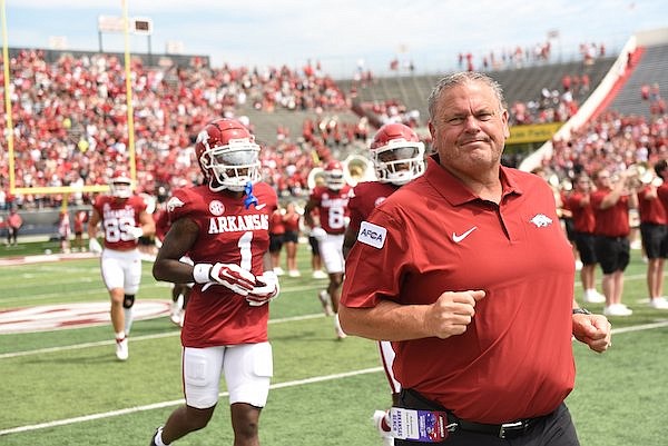 Arkansas coach Sam Pittman runs onto the field prior to a game against Western Carolina on Saturday, Sept. 2, 2023, in Little Rock.