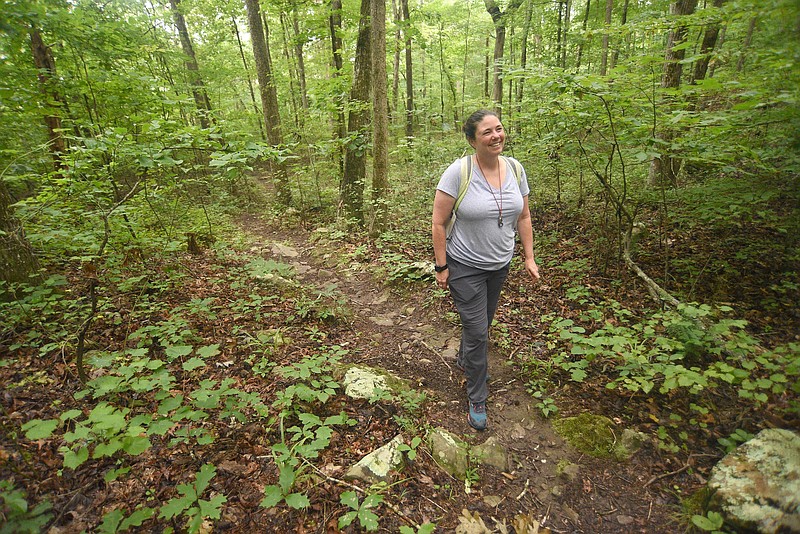 Staff photo by Matt Hamilton/ Amy Brock-Hon hikes a trail in the Prentice-Cooper Wildlife Management Area.