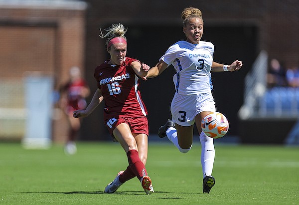 Arkansas forward Anna Podojil (16) shoots and scores as she is defended by North Carolina's Savy King during a game Sunday, Sept. 3, 2023, in Chapel Hill, N.C. (Photo by David Beach, Special to the Hawgs Sports Network)